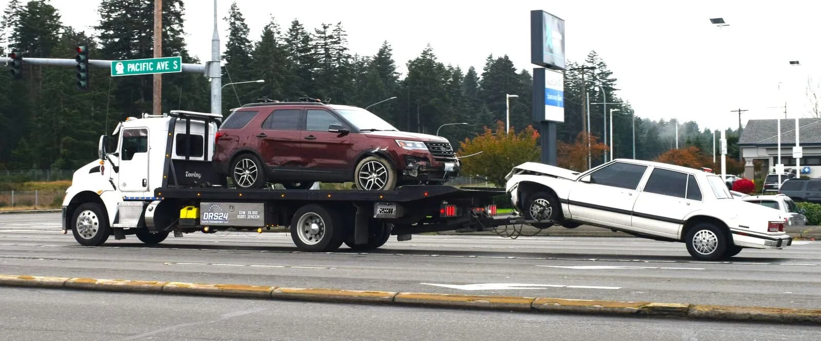 A junk vehicle in a lot, ready for pickup