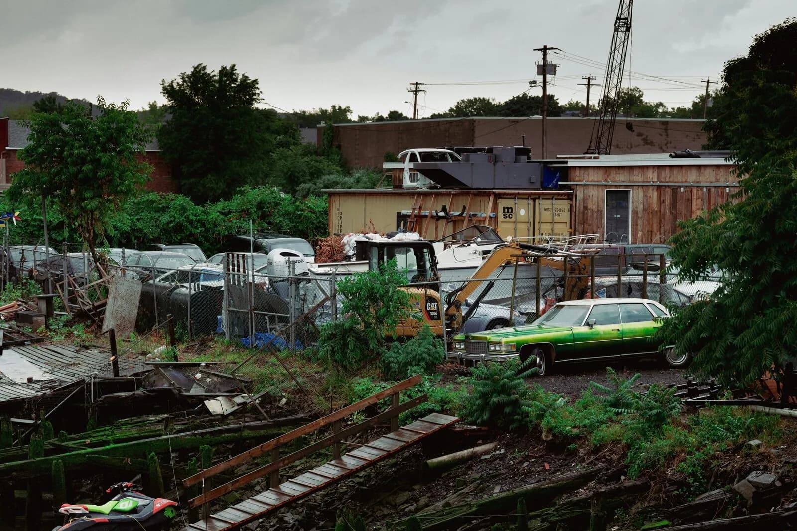 A cluttered junk vehicle lot